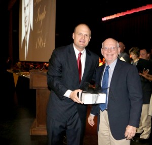 Carrollton High School Principal Dr Mark Albertus, left, presents a gift to the 2014 recipient of the Carrollton High School Distinguished Alumni Award to Dr. Richard M. “Dick” Ingle. The presentation was made April 24 at the CHS honors program.