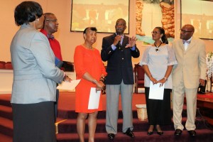 Living Well with Chronic Disease instructor Jarvis Daniel addresses the congregation of First Baptist Church of Carrollton. Living Well graduates Nettie Geter, Emanuel Geter and Elerie Daniel were presented certificates of completion by Pastor Bradley Bell and his wife, Lorie.